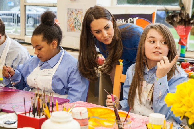Duchess of Cambridge's visit to Northolt High School: Duchess looks at students at work in an art class
